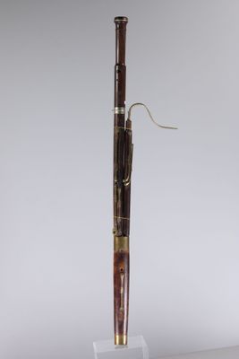 a pen with a wooden handle on a clear base