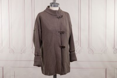 an image of a coat on a mannequin stand