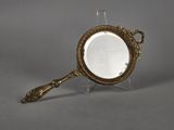 an image of a mirror with a handle and a handle on it