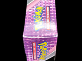 a box of candy sitting on top of a black table