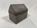 an old metal box with a lid on a white background