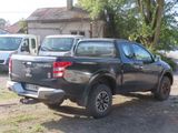 a picture of a pickup truck parked in front of a house