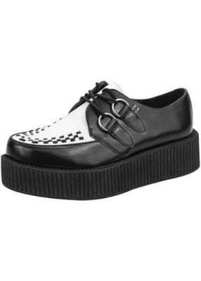une photo d'une chaussure noire et blanche munie d'une boucle