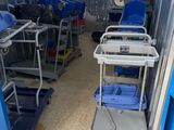 many carts that are sitting in a storage room