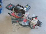 someone is using a circular saw to cut a piece of wood