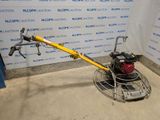 a machine that is sitting on the floor in front of a wall
