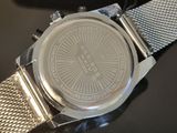 a close up of a watch on a table