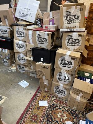 many boxes stacked on top of each other on the floor