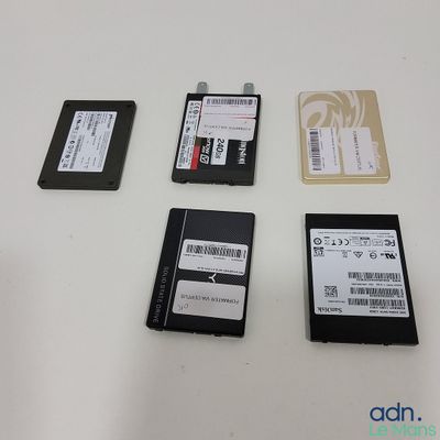 several different types of hard drives are laid out on a table