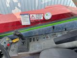a close up view of a vehicle ' s dashboard with a warning sticker on it