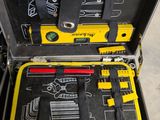a tool case with tools in it sitting on the floor