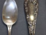 three spoons that are sitting on a table
