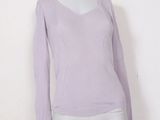 the mannequin mannequin is wearing a purple sweater and shorts
