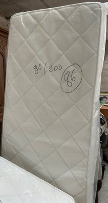 two mattresses that are sitting in a room