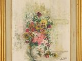 painting of flowers in a vase on a table in a gold frame