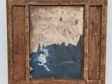 an old wooden frame with a painting of a man on it