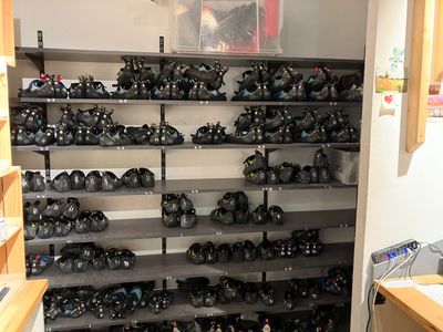 a room with a lot of shoes on the shelves