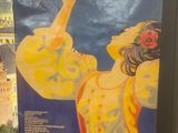 a poster of a woman holding a rose in her hand