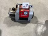 an image of a small air compressor sitting on the floor