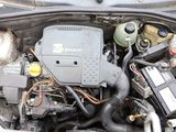 a picture of a car engine with its hood open