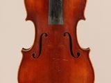 an old violin with a bow hanging from it ' s back
