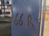 a close up of a blue door with numbers on it