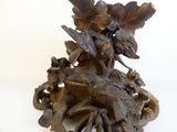 a statue of a woman riding on a carriage with flowers