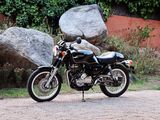 a motorcycle that is parked on the side of the road