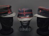 three hats are lined up on top of a mannequin head