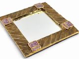 mirror with gold frame and purple tiles on top of it