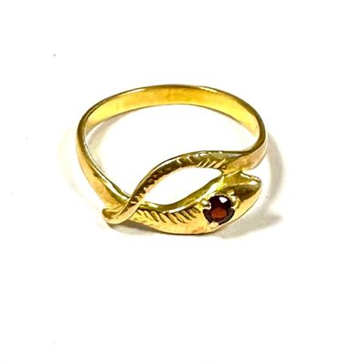 gold plated ring with garnett stone and leaf design