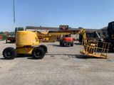 a yellow crane that is parked in a parking lot