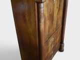an image of a wooden chest of drawers with a marble top