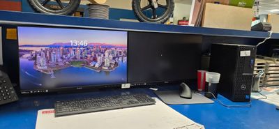 a desktop computer sitting on a desk with a keyboard and mouse