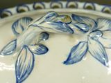 a blue and white bowl with a fish design on it