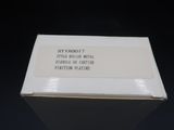 a white box with a label on it on a black surface