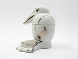 a white bird with a tape around its neck
