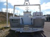 a boat that is parked on the side of the road
