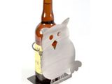 a bottle holder with a white owl on it