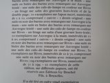 an open book with a black and white image of a man ' s face