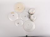 a lot of plates and cups sitting on a table