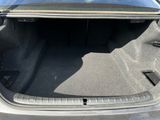 the trunk of a car with its trunk open and the seat folded down