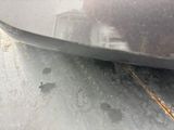 a close up of a car ' s front bumper with scratches