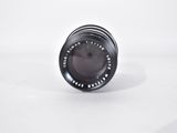 an image of a black camera lens on a white background