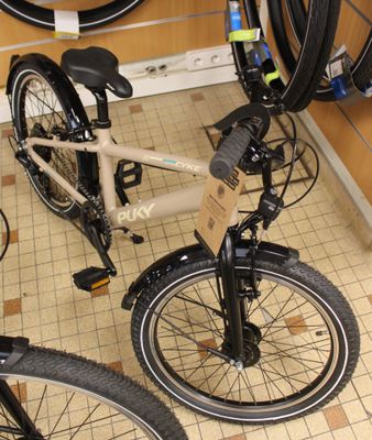 two bikes that are sitting on the floor in the room