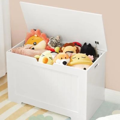 a toy box with stuffed animals in it on the floor