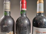 three bottles of wine sitting next to each other on a table