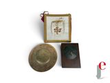 a small box with a picture on it next to a small bowl