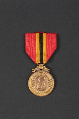 a close up of a medal on a black surface