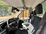 the interior of a van with the driver ' s seat folded down